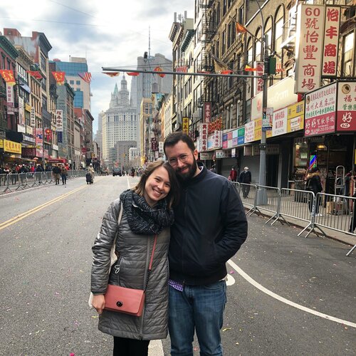 Julia and Nick smiling in the street after the Lunar New Year Parade